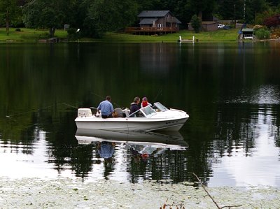 A family of boaters on Black Lake in Olympia, Washington.
