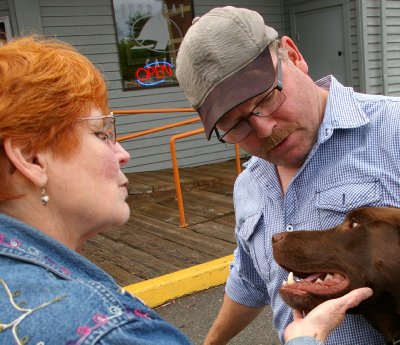 Trevor the chocolate Labrador outside the Budd Bay Cafe in Olympia, Washington.