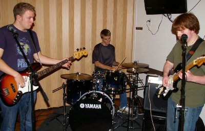 Grant Reike on bass, Ryan Leach on drums, and TJ Cope guitar and vocals - Cloud Chowder.