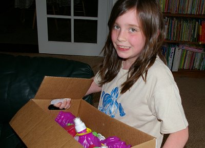 Granddaughter Izzy with a box of Krazy Kritters in Parkland, Washington.